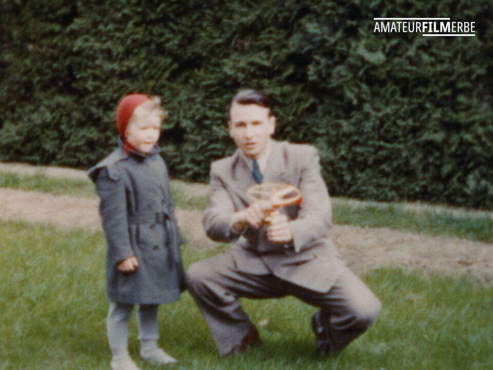 Easter egg and flying top hunt in a garden – Still 5/8
